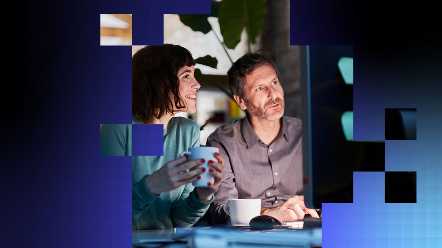 Two people looking at information on a computer