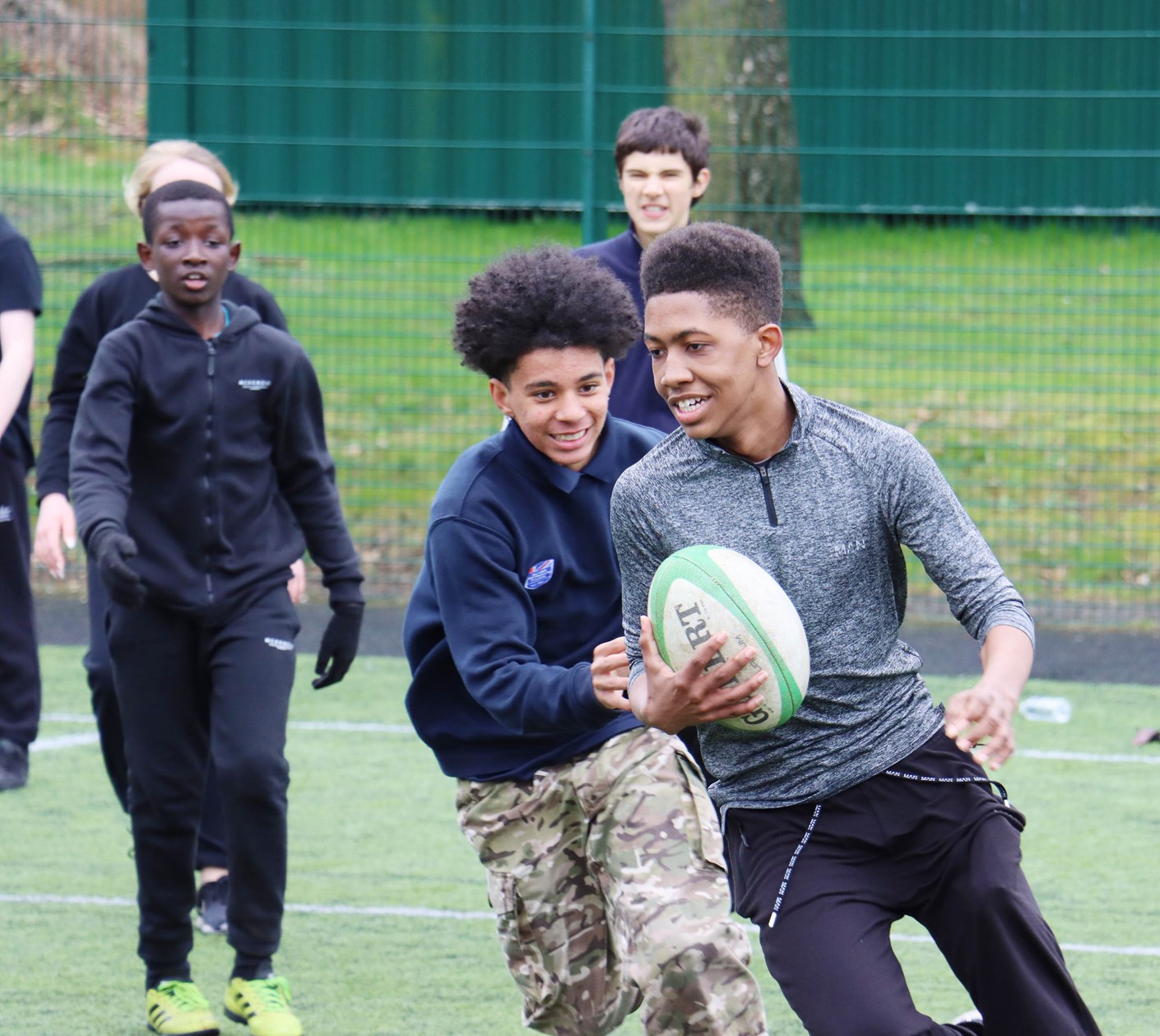 A group of boys playing rugby