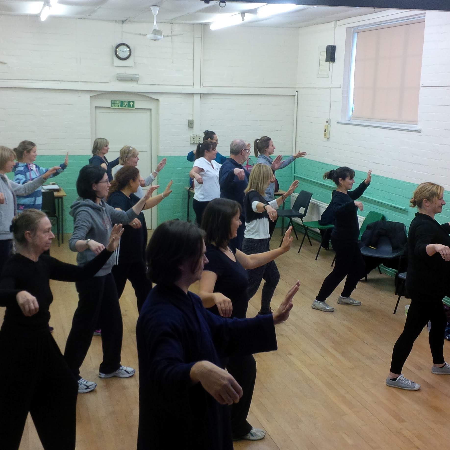 A group of people doing Tai Chi