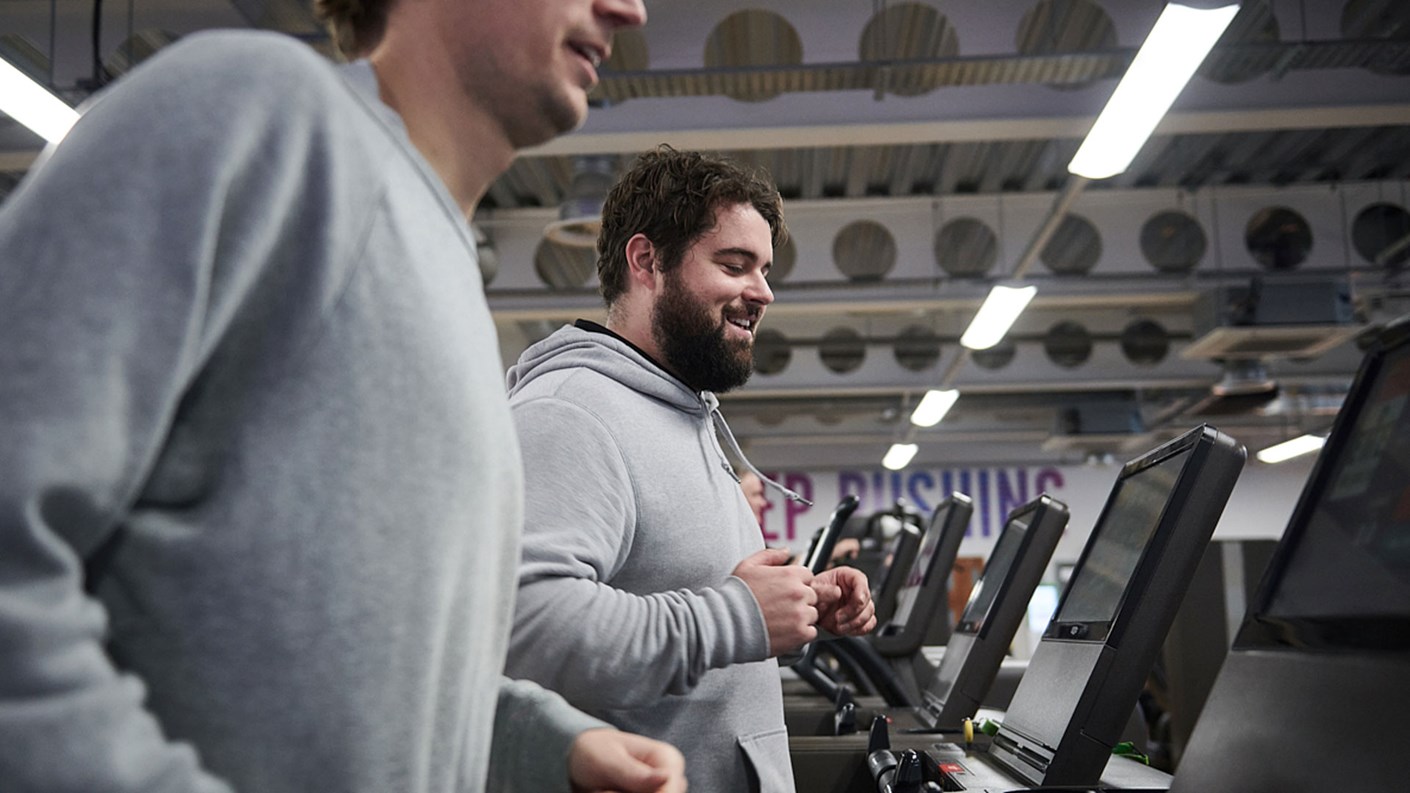 A man running on a running machine