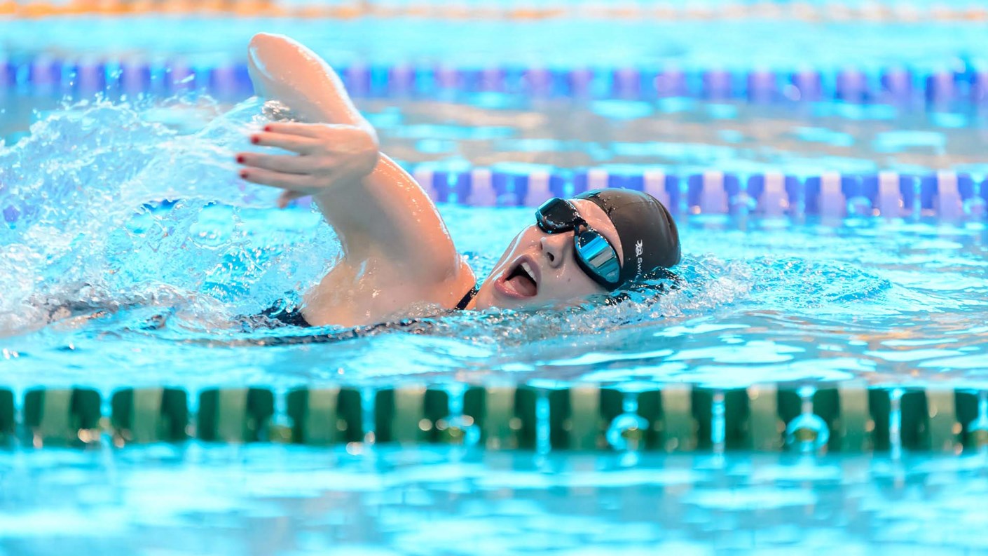 Person swimming in a pool